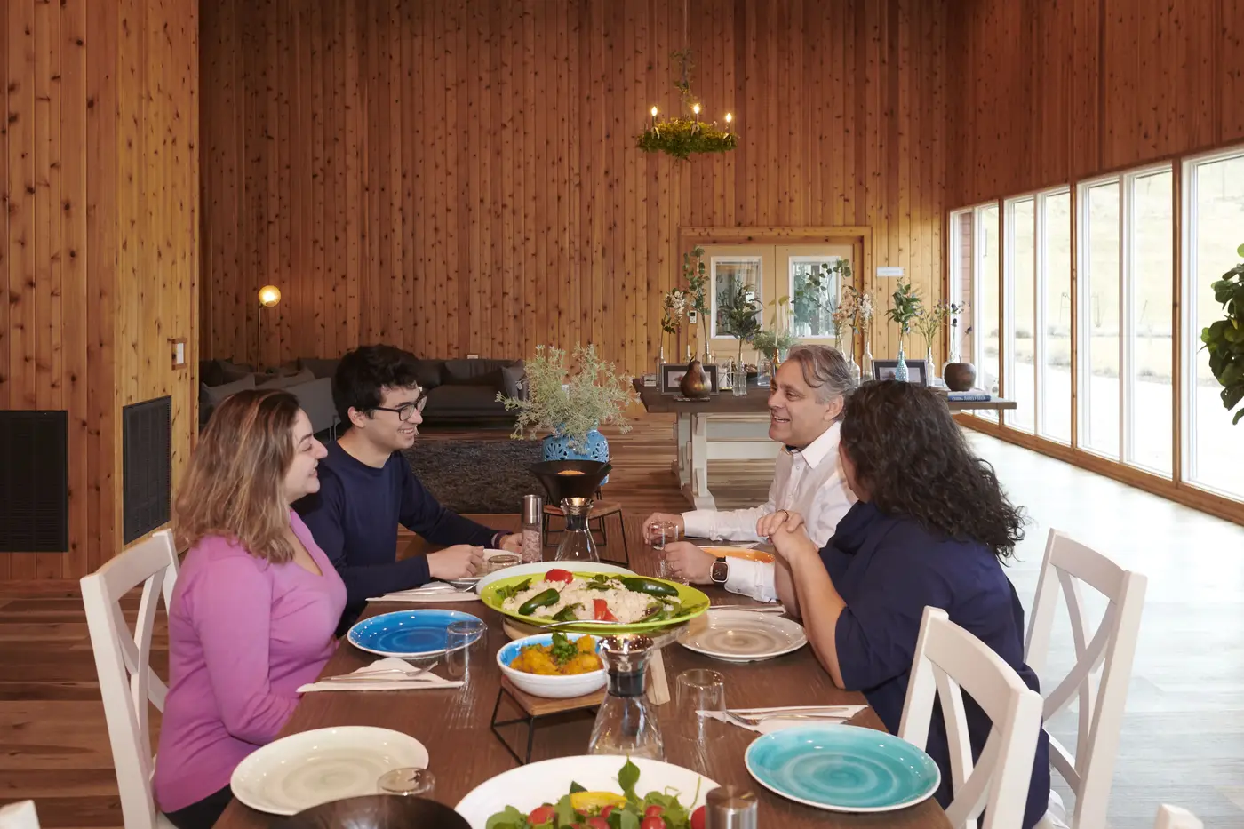 Guests sharing a farm-to-table meal in the dining hall