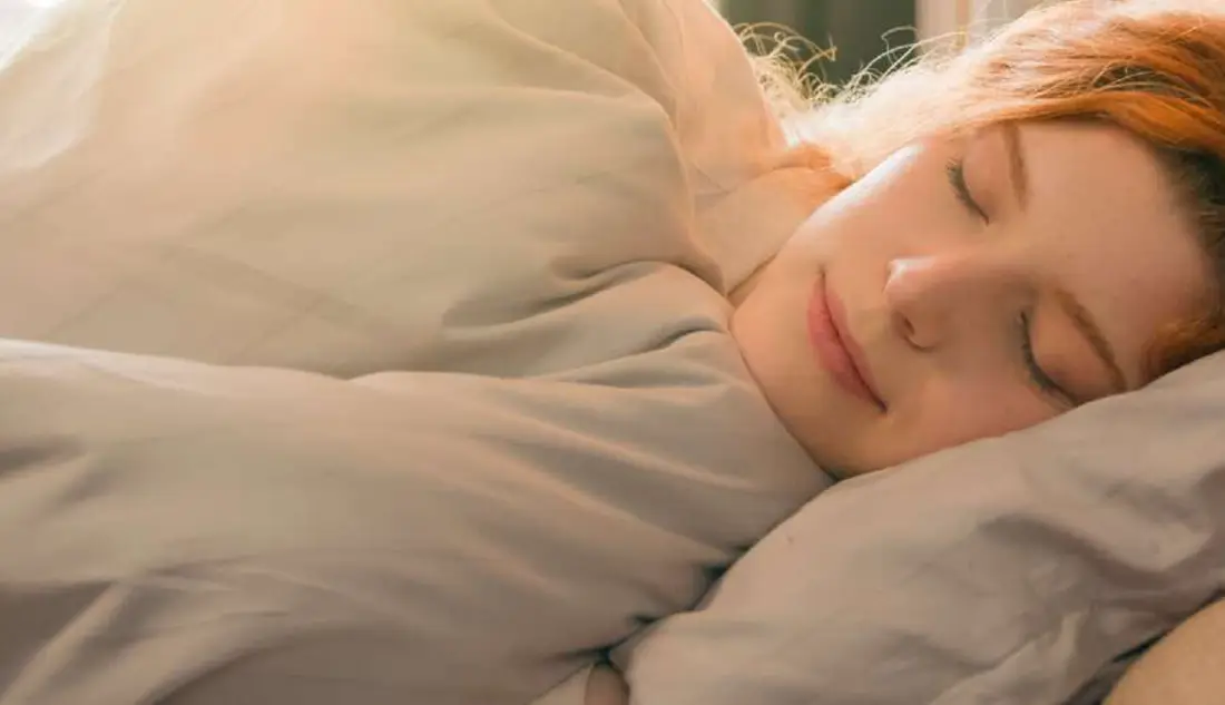A guest sleeping deeply in a Eupepsia guest room